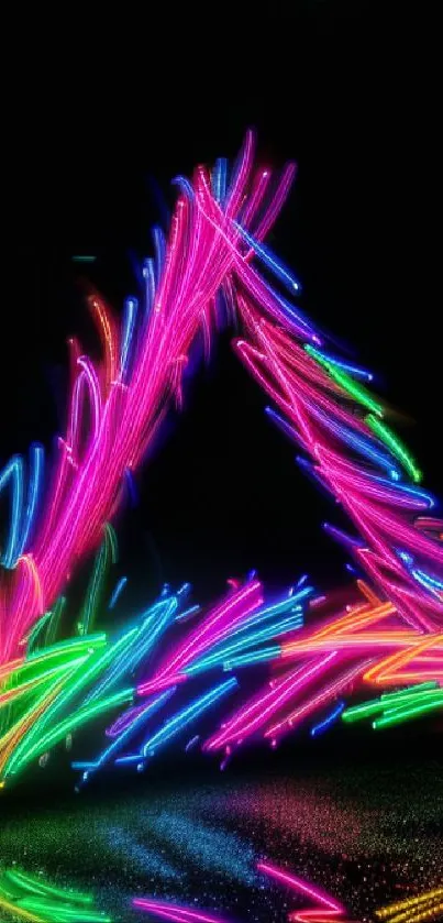 Neon triangle with vibrant color trails on a black background.