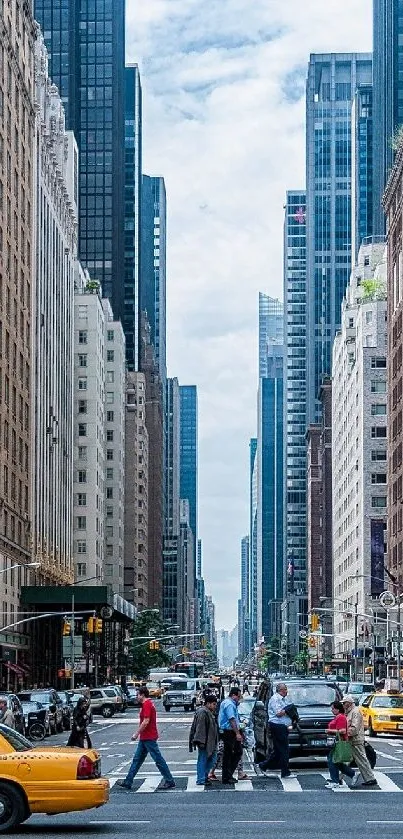 New York City street with yellow taxis and skyscrapers in the background.