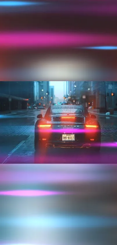 Rear view of a luxury car driving through a neon-lit city street at night.