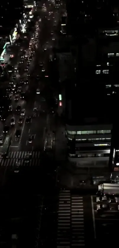 Nighttime aerial view of a busy city street.