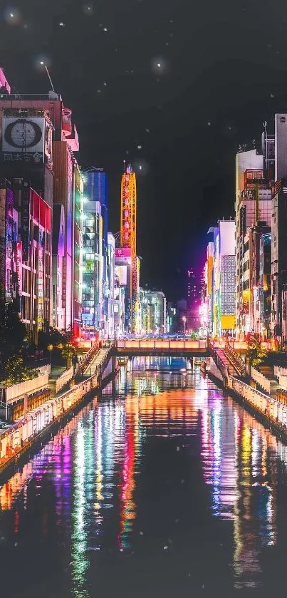 Vibrant cityscape at night with colorful reflections in the canal.