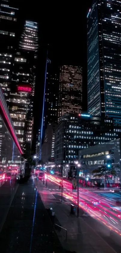 Night cityscape with skyscrapers and vibrant street lights.