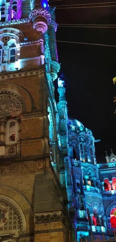 Vibrant night cityscape with gothic building lighting.