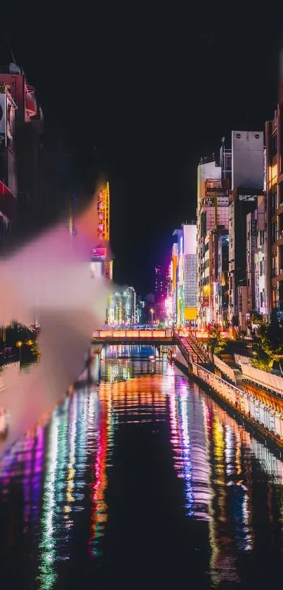 City nightscape with vibrant neon lights reflecting in a canal.