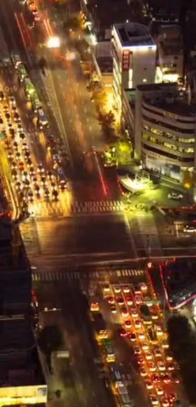 Aerial view of bustling night city with vibrant lights and traffic.