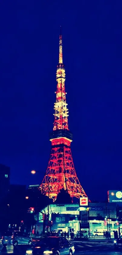 City tower illuminated at night against dark blue sky.