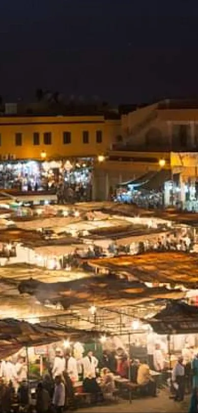 Lively night market scene under dark sky with vibrant, colorful stalls and crowds.