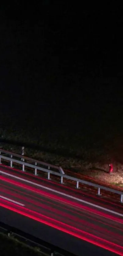 Night road with red light streaks, dynamic mobile wallpaper.