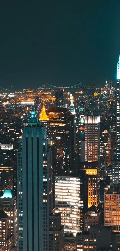 New York City skyline at night with illuminated skyscrapers.