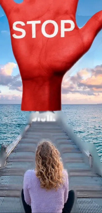 Dramatic ocean view with red stop hand overlay.