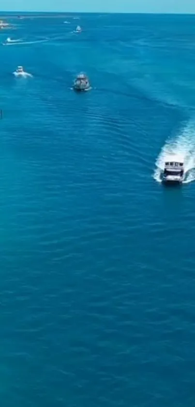 A stunning ocean view wallpaper with vivid blue waters and boats cruising by.