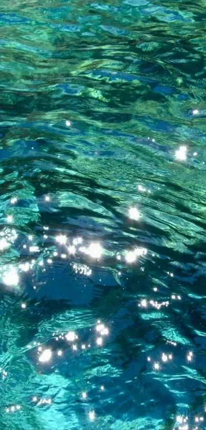 Shimmering teal ocean waves with sunlight reflections.