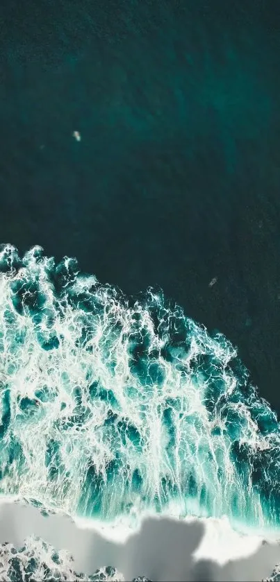 Turquoise ocean waves with white froth crashing onto shore.