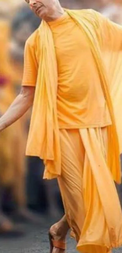 Orange-clad figure in a dynamic dance pose, exuding vibrancy.