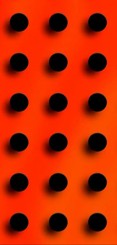 Vibrant orange wallpaper with black dots.