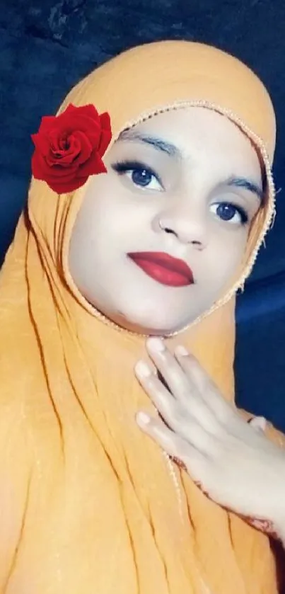 Person in orange hijab with red rose accent.