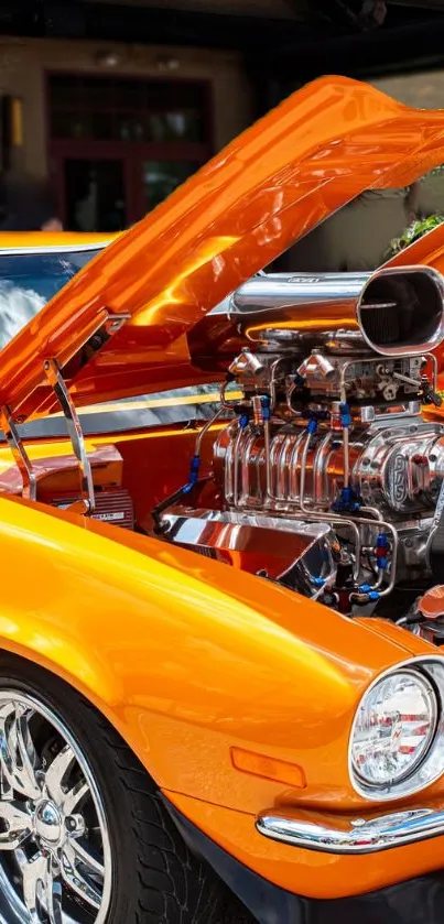 Vibrant orange muscle car with open hood and detailed engine display.