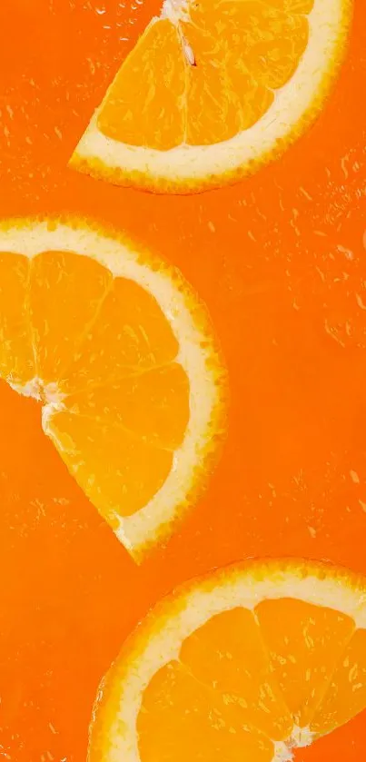 Mobile wallpaper with vibrant sliced oranges on an orange background.