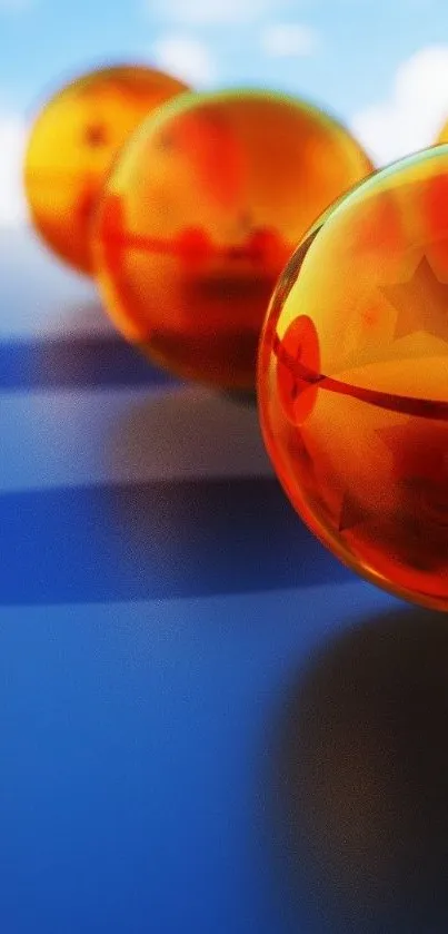 Vibrant orange spheres with star patterns on a blue sky background.