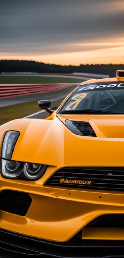 Orange sports car on track at sunset.