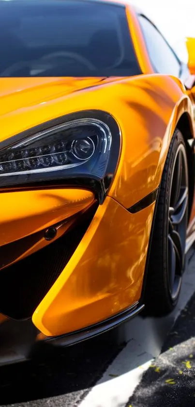 Orange sports car with sleek design, parked outdoors.