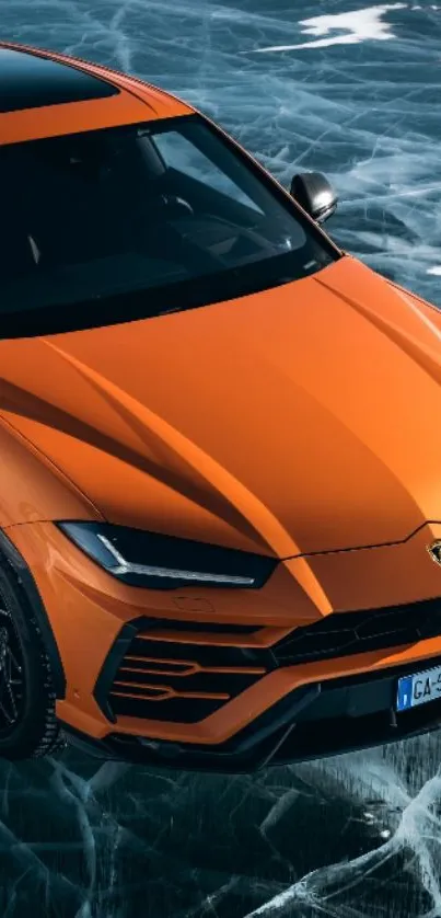 Orange sports car on icy background wallpaper.