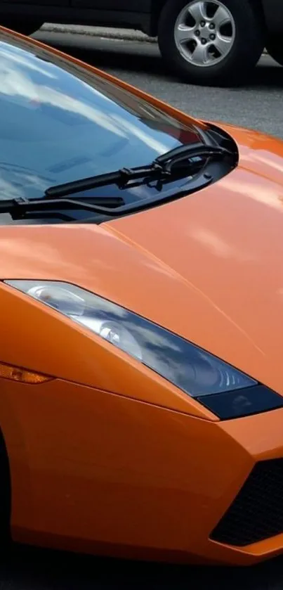 Vibrant orange sports car wallpaper for mobile screens.