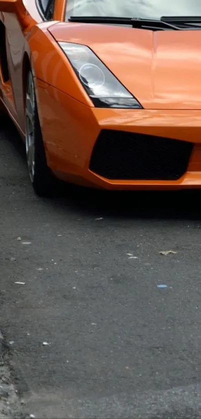 Orange sports car parked on street view.