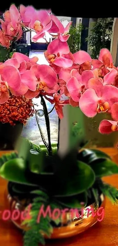 Pink orchid arrangement with 'Good Morning' text.