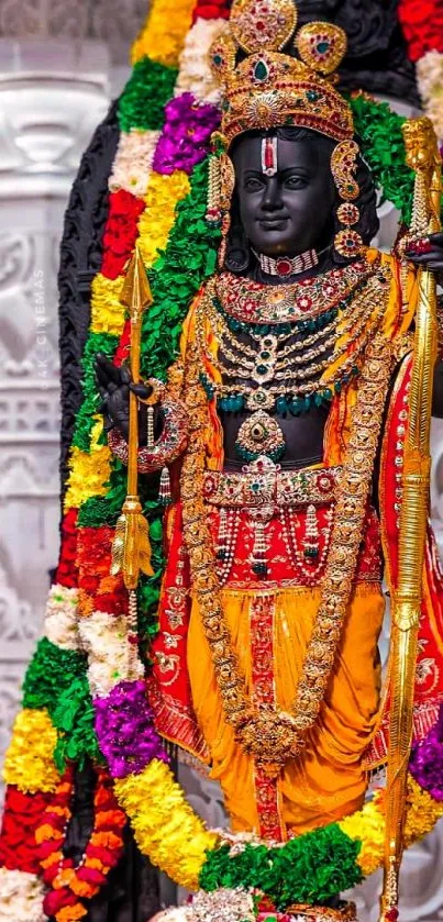 Colorful Hindu deity with garlands and jewelry.