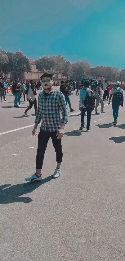 A vibrant outdoor scene with people walking under a clear blue sky.