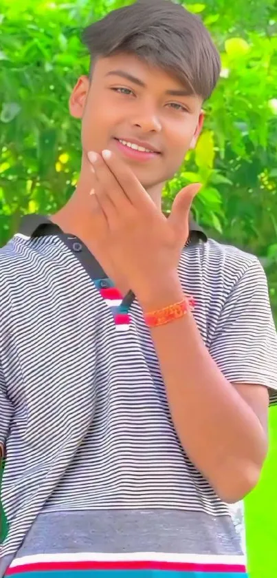 Young person smiling outdoors with a vibrant green background.