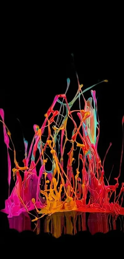 Colorful paint splashes on a dark background wallpaper.