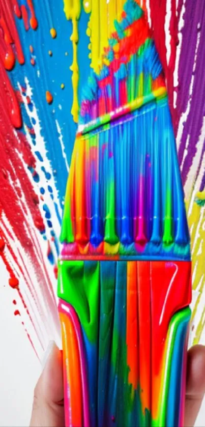 Colorful paintbrush with vibrant paint splashes wallpaper.