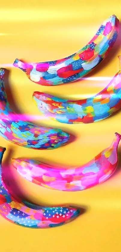 Vibrant painted bananas on a yellow background, perfect for colorful wallpapers.