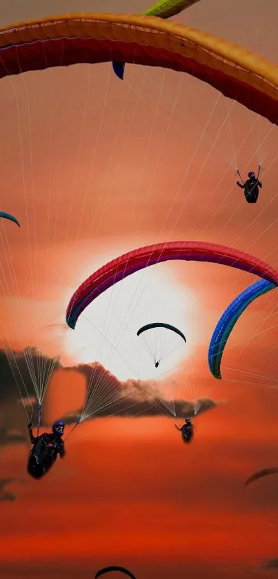 Colorful paragliders flying against a stunning sunset sky.