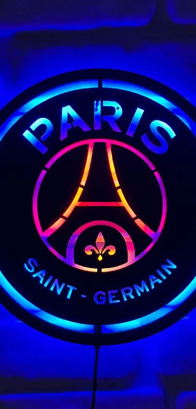 Neon Paris sign with Eiffel Tower on a blue background.