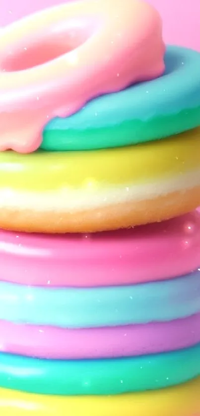 A stack of colorful pastel donuts on a pink background wallpaper.