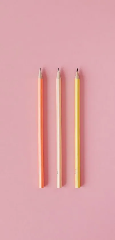 Vibrant pastel pencils on a soft pink background mobile wallpaper.