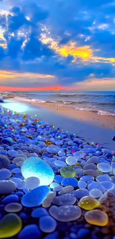 Colorful pebbles at a vibrant sunset beach with ocean waves and a glowing horizon.