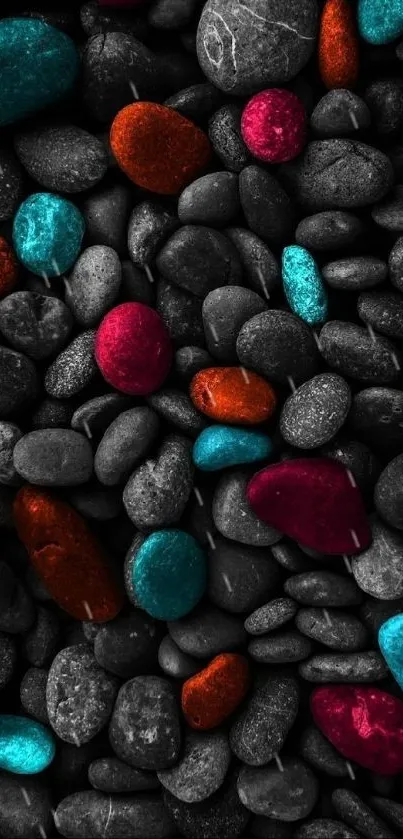 Vibrant, colorful stones on a gray pebbles background.