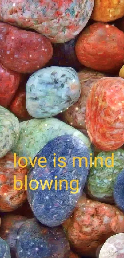 Colorful pebbles with 'love is mind blowing' quote.