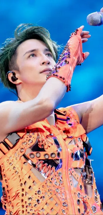 Vibrant performer on stage with a microphone and colorful attire.