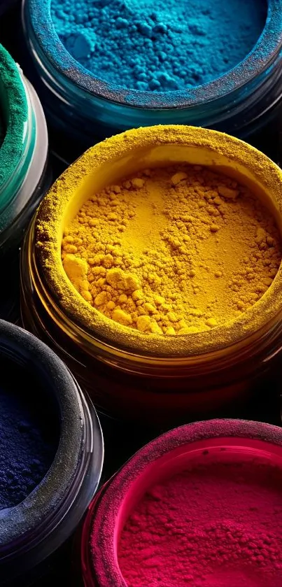 Colorful pigment jars filled with vibrant powder in various hues.