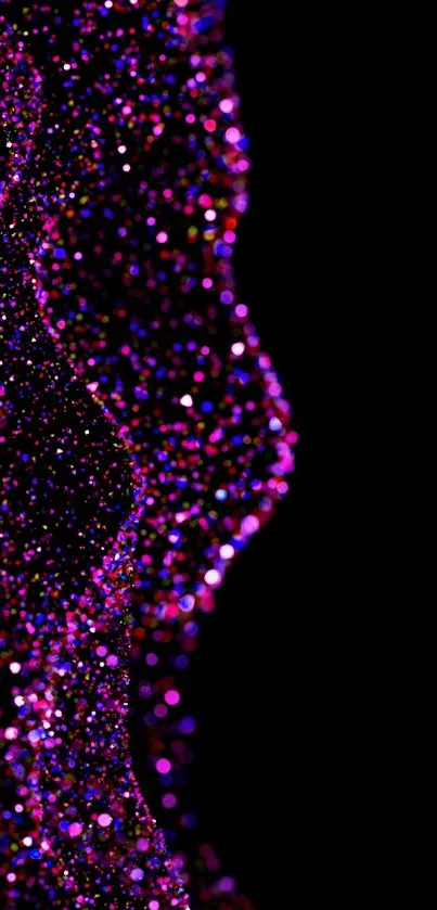 Vibrant pink particles create an abstract pattern on a black background.