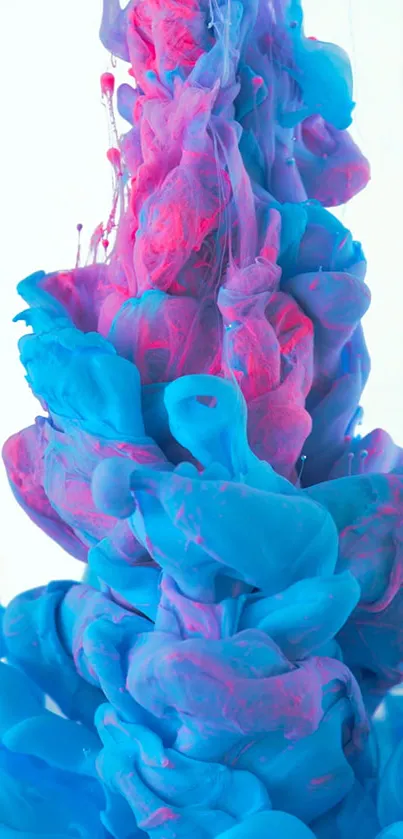 Vibrant splash of pink and blue paint, creating an abstract mobile wallpaper.