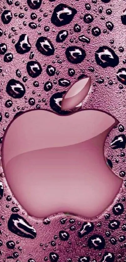 Pink Apple wallpaper with glossy water droplets on a textured background.