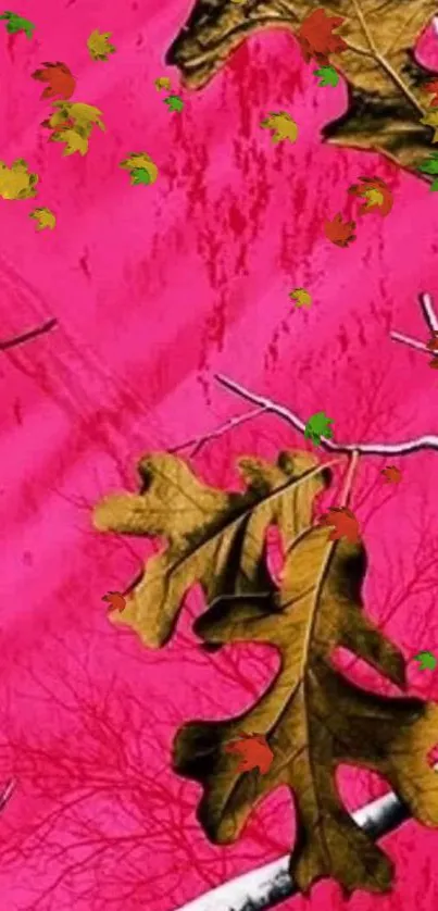 Bright pink wallpaper with brown autumn leaves and bare branches.