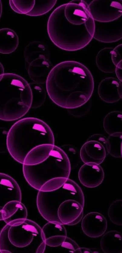 Vibrant pink bubbles on black background wallpaper.