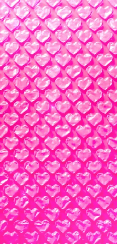 Pink wallpaper with heart-shaped bubble design pattern.